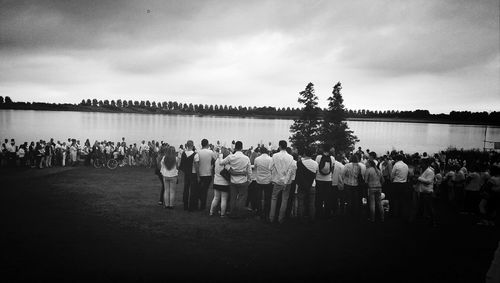 People at observation point against sky