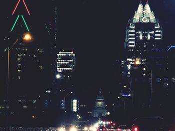 Illuminated buildings in city at night