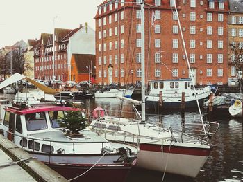 Boats moored in city