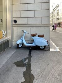Car on street against building in city