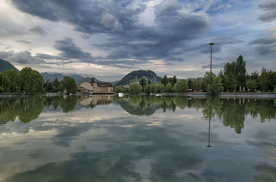 Scenic view of lake against cloudy sky