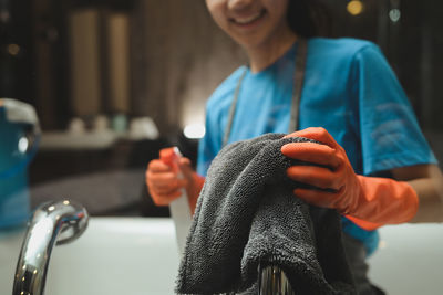 Midsection of man washing hands