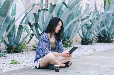 Happy asian woman, student relaxing, working in city, garden. laptop, phone. social media. summer