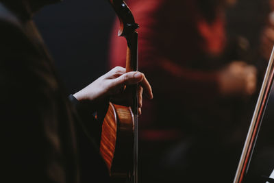 Close up hand holding violin