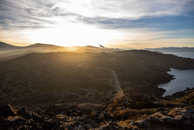 Scenic view of mountain against sky during sunset