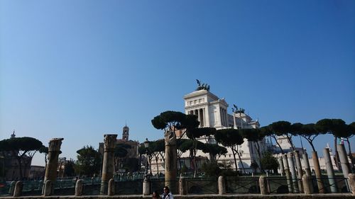 Low angle view of building against blue sky