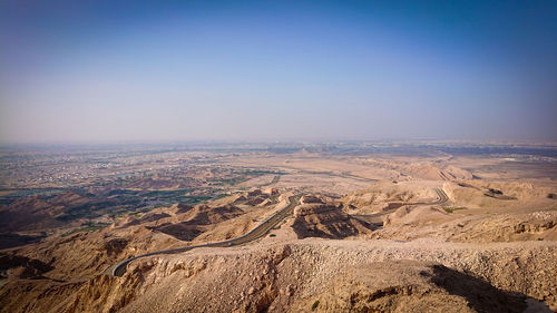 Scenic view of desert against clear sky