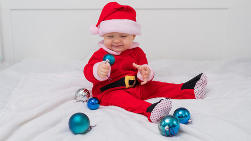 Portrait of cute boy playing with toy on table