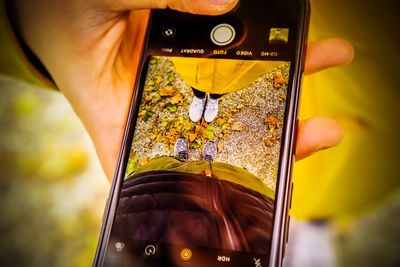 Close-up of person holding camera