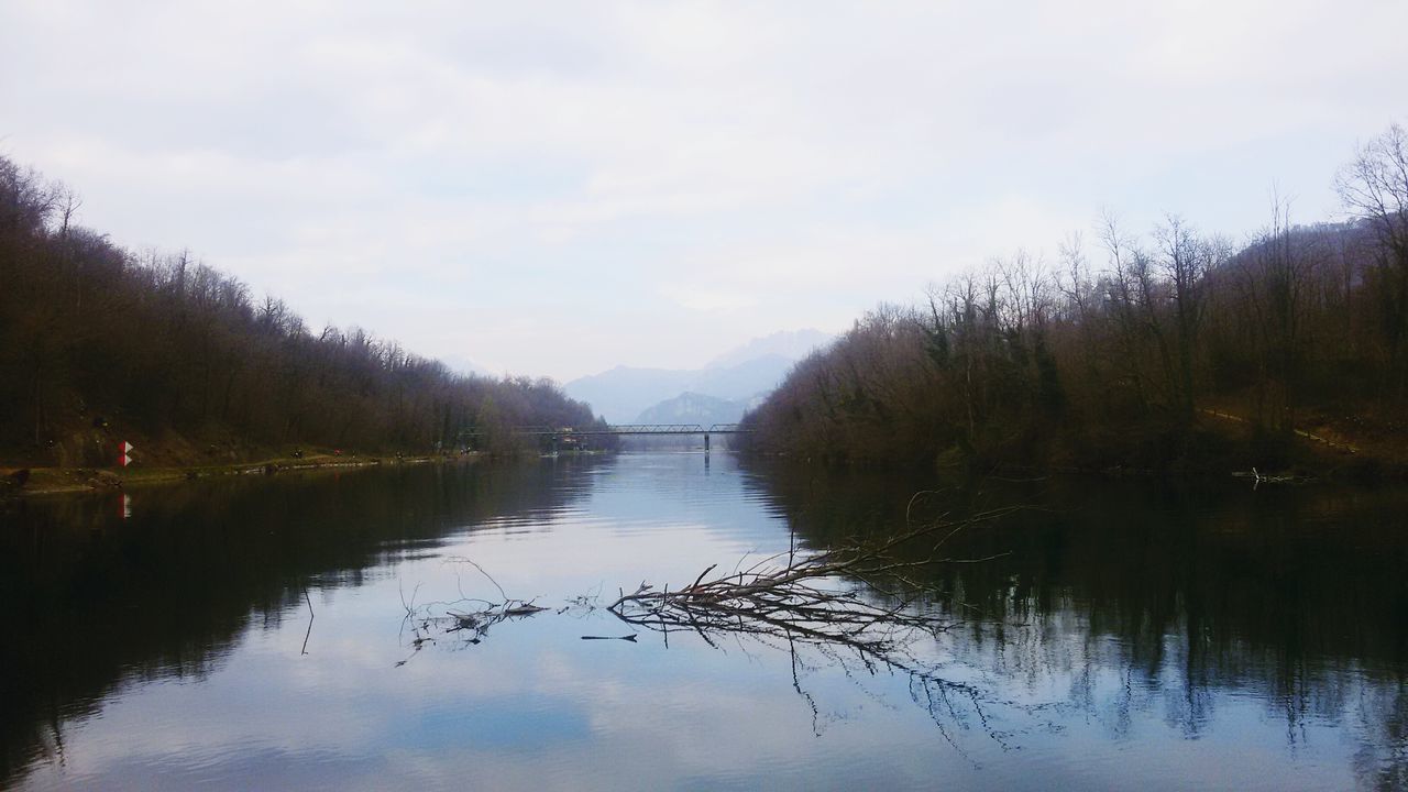 water, tree, reflection, tranquility, tranquil scene, lake, waterfront, sky, scenics, beauty in nature, river, nature, mountain, bare tree, cloud - sky, standing water, idyllic, calm, non-urban scene, outdoors