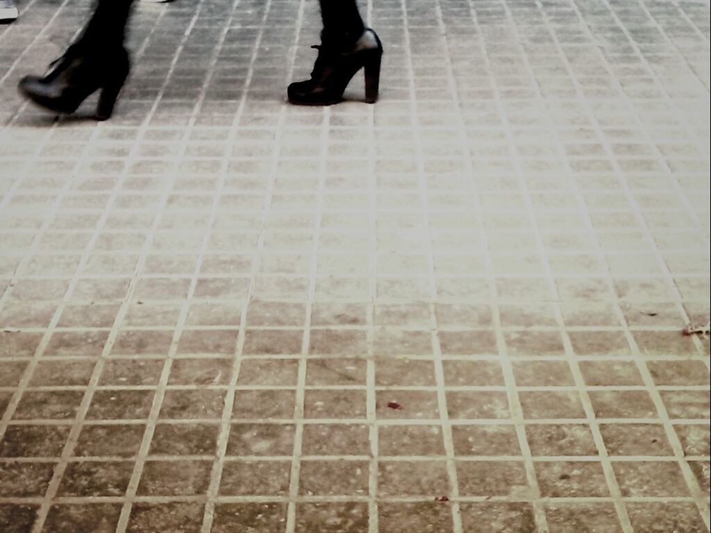 low section, men, lifestyles, person, leisure activity, walking, standing, high angle view, unrecognizable person, shoe, human foot, city life, street, shadow, pattern