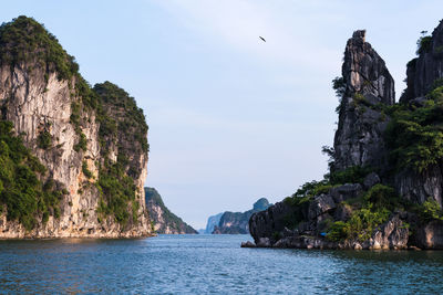 Panoramic view of sea and mountains against sky