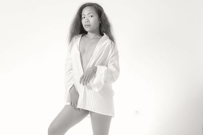 Portrait of a beautiful young woman over white background