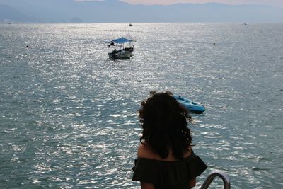 Rear view of woman looking at sea