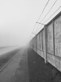 Road along concrete wall