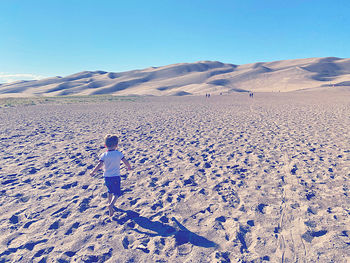 Scenic view of desert against clear sky