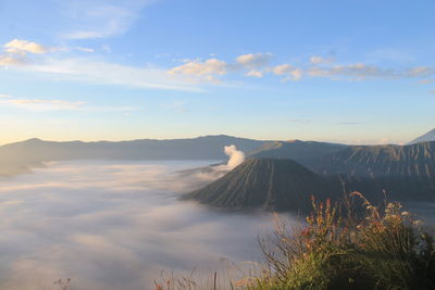 View of volcanic landscape against cloudy sky