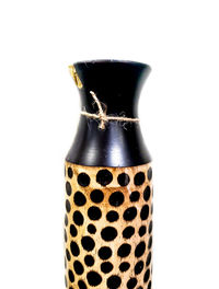 Close-up of beer bottle against white background