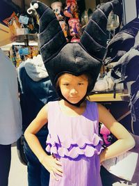 Portrait of girl standing in store