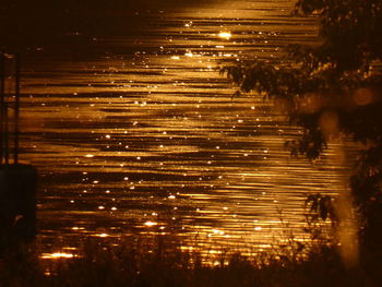 Reflection of illuminated lights in water at night