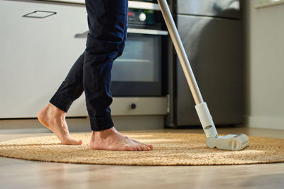 Low section of man standing on floor