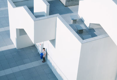 High angle view of people walking on modern building