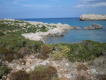 Scenic view of sea against cloudy sky