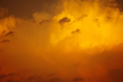 Low angle view of cloudy sky at sunset