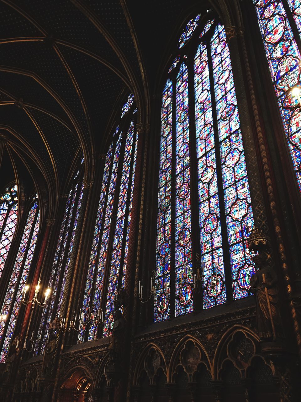 religion, place of worship, spirituality, stained glass, architecture, indoors, rose window, window, built structure, low angle view, no people, cross, day, multi colored