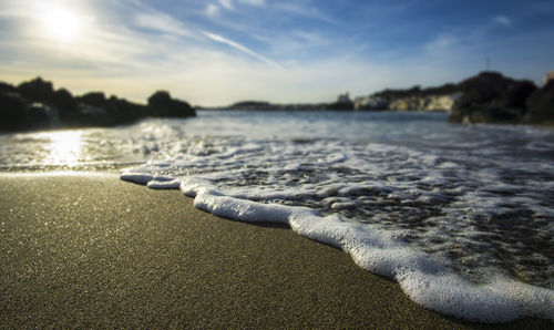 Surface level of beach against sky