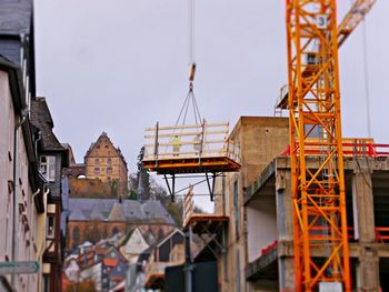 Close-up of construction site against sky