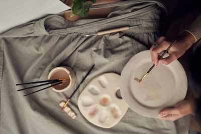 High angle view of person preparing food on table