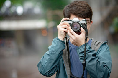 Portrait of man photographing