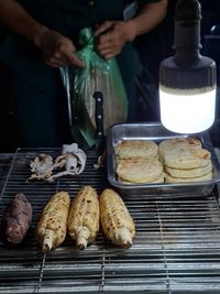 Close-up of people preparing food