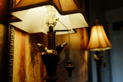 Close-up of illuminated lamp at home