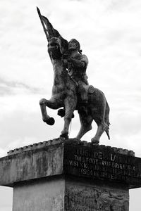 Low angle view of statue against sky