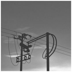 Low angle view of electricity pylon