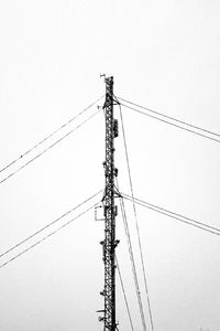 Low angle view of electricity pylon