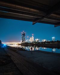 Reflection of city in water at night