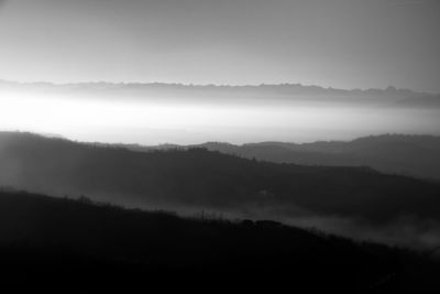 Scenic view of silhouette mountains against sky