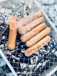 High angle view of meat on barbecue grill
