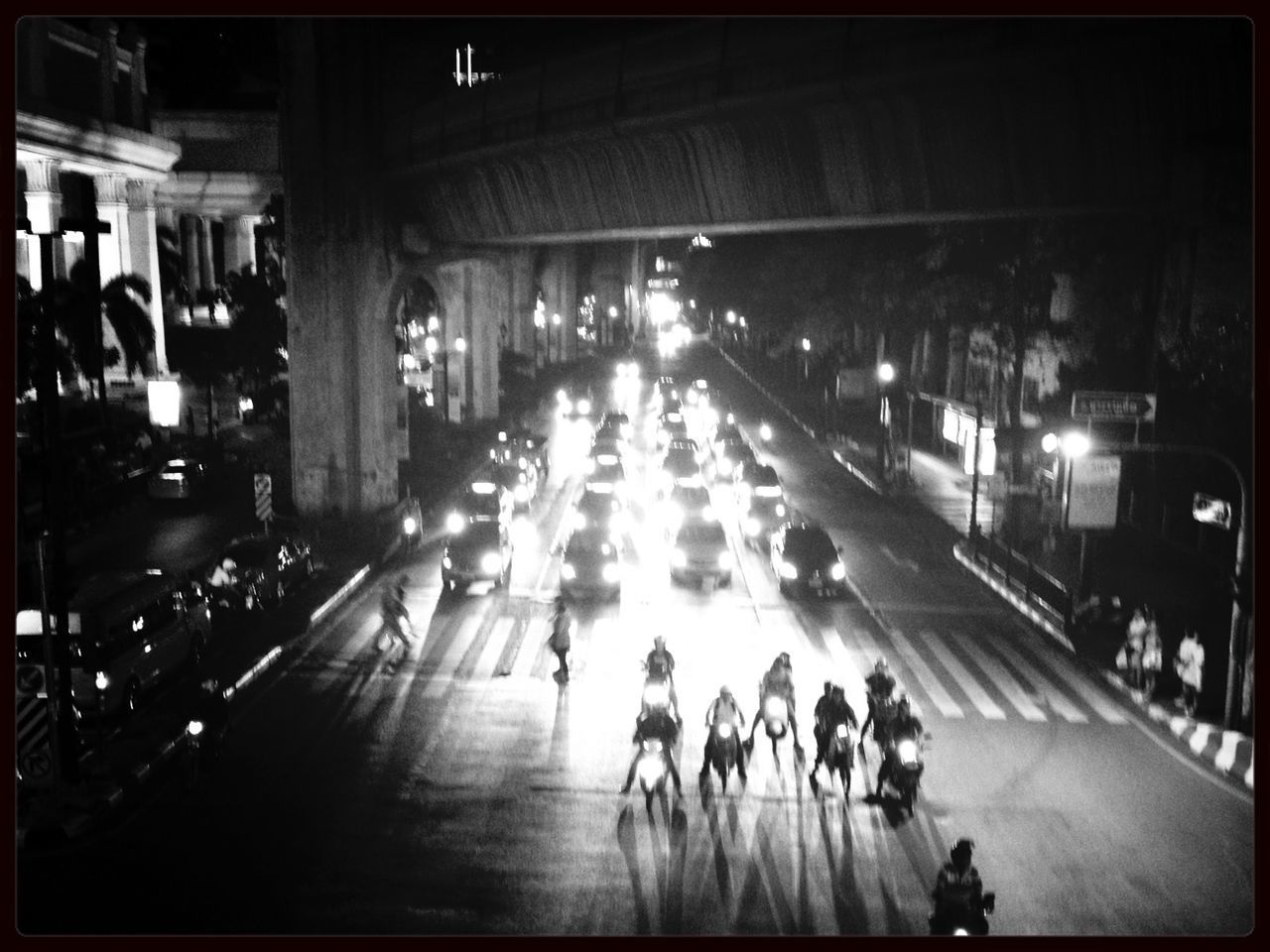 transportation, illuminated, night, street, city life, architecture, land vehicle, car, built structure, city, mode of transport, large group of people, building exterior, road, city street, incidental people, on the move, high angle view, travel