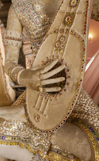 Midsection of woman wearing mask shoes