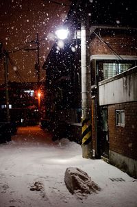 Snow covered street at night