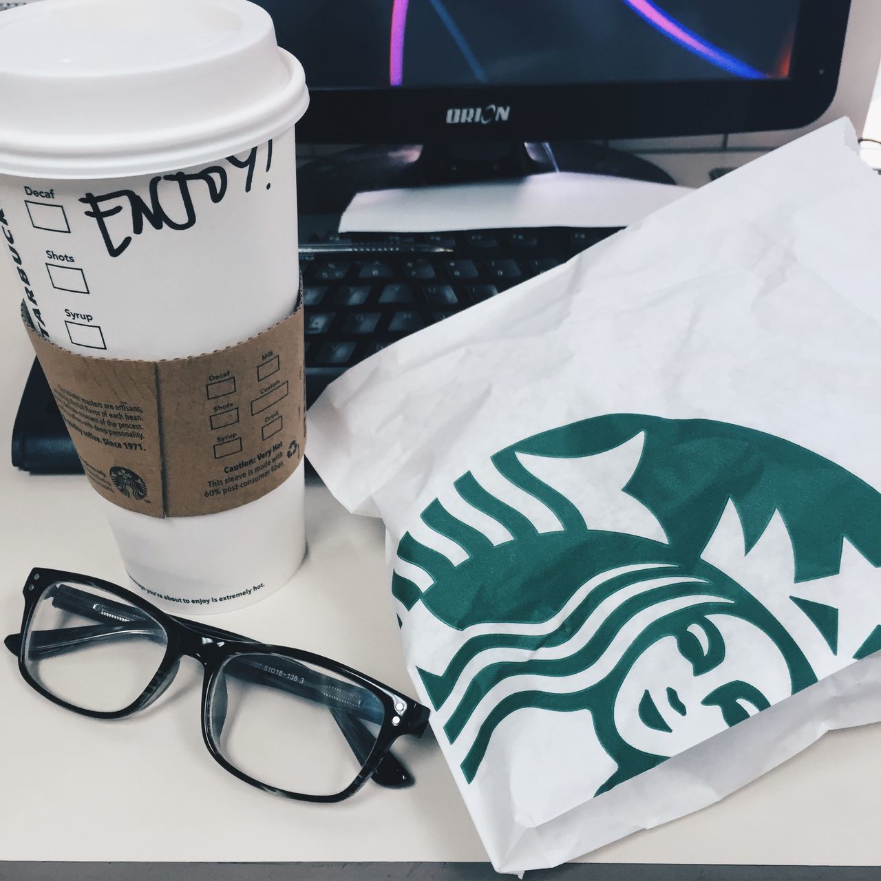 indoors, text, communication, still life, close-up, western script, table, high angle view, no people, number, paper, drink, coffee cup, technology, refreshment, food and drink, white color, focus on foreground, cup, capital letter