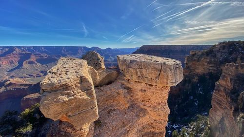 Panoramic view of rock formations against sky