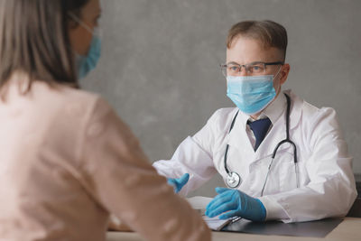 Doctor examining patient in hospital