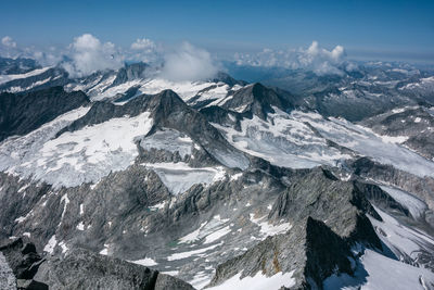 Aerial view of snowcapped mountains against sky