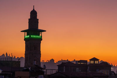 Mosque minaret in jerusalem at sunset