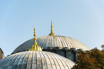 High section of temple building against clear sky